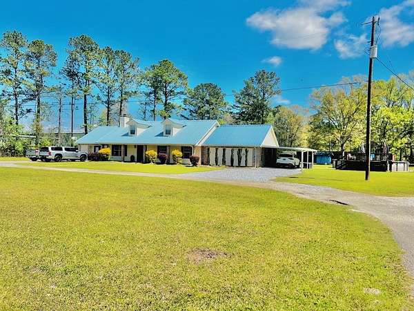 10.1 Acres of Recreational Land with Home for Sale in Picayune, Mississippi