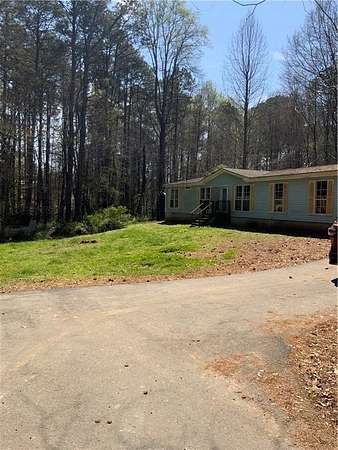 7.87 Acres of Land with Home for Sale in Loganville, Georgia