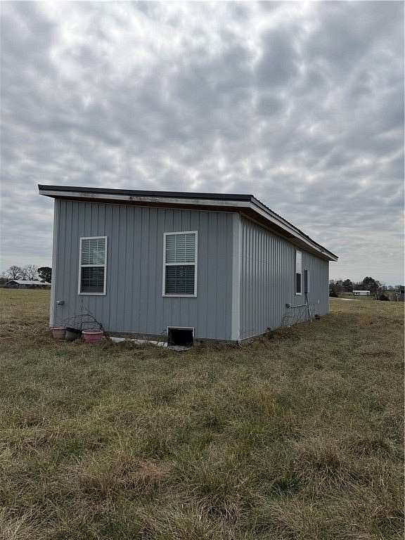 5 Acres of Land with Home for Sale in Gravette, Arkansas