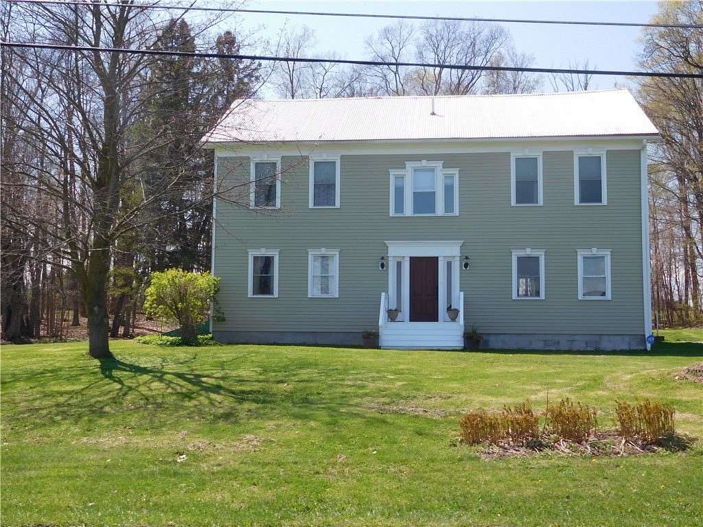 6.49 Acres of Land with Home for Sale in Lansing, New York