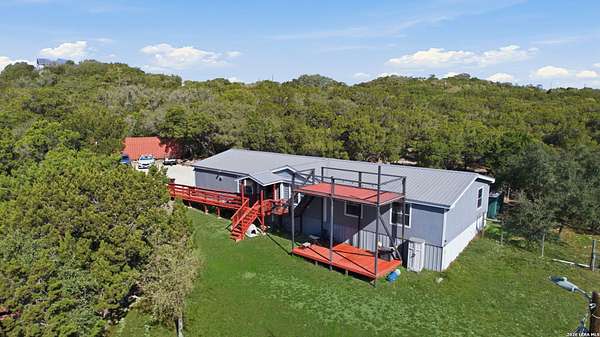 9.4 Acres of Land with Home for Sale in Lakehills, Texas