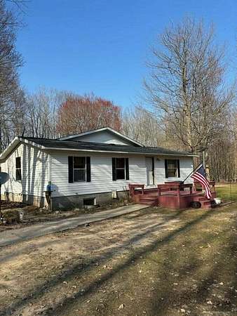 30 Acres of Land with Home for Sale in Free Soil, Michigan