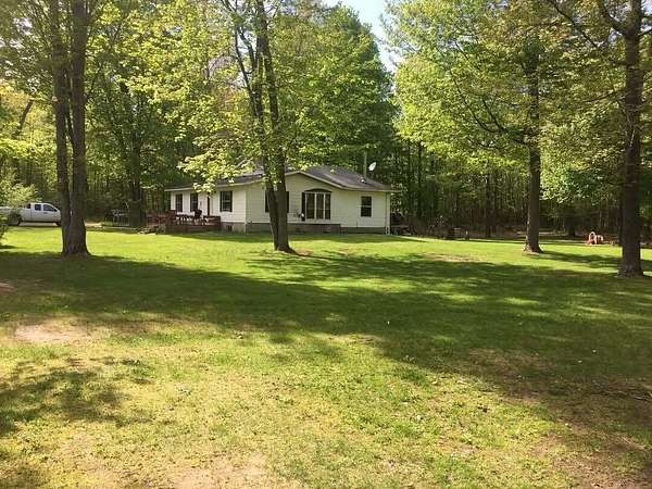 30 Acres of Land with Home for Sale in Free Soil, Michigan