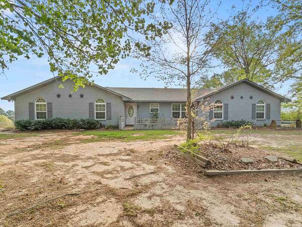 6.8 Acres of Land with Home for Sale in Daingerfield, Texas