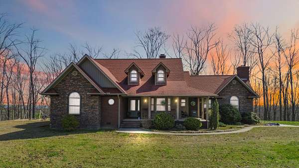 10.7 Acres of Land with Home for Sale in Strunk, Kentucky