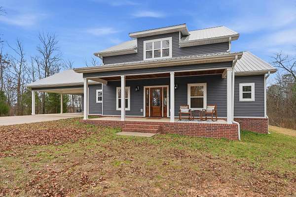 5.6 Acres of Land with Home for Sale in Perryville, Arkansas