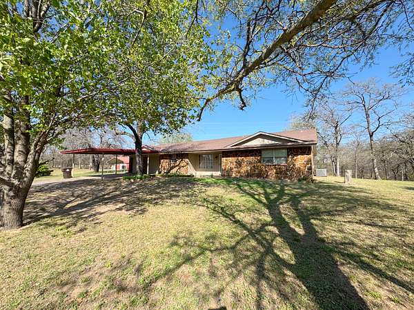55 Acres of Recreational Land with Home for Auction in Meeker, Oklahoma