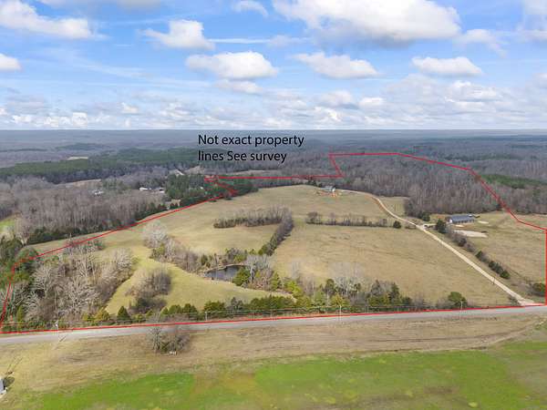 124 Acres of Land with Home for Sale in Holladay, Tennessee