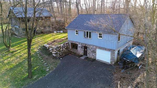 4.72 Acres of Land with Home for Auction in Middlebury, Indiana