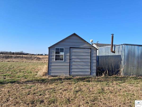 25 Acres of Land with Home for Sale in Stockton, Missouri