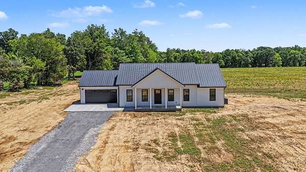 Land with Home for Sale in Nortonville, Kentucky