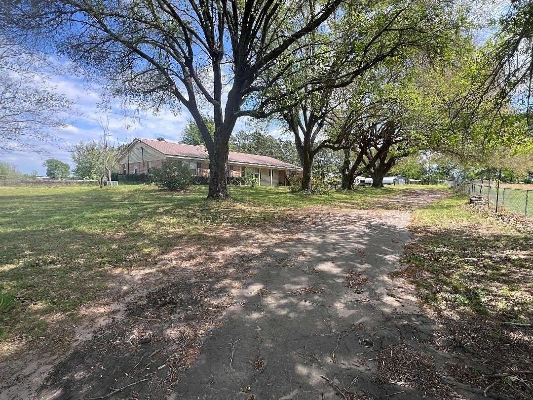 10 Acres of Land with Home for Sale in Carthage, Texas
