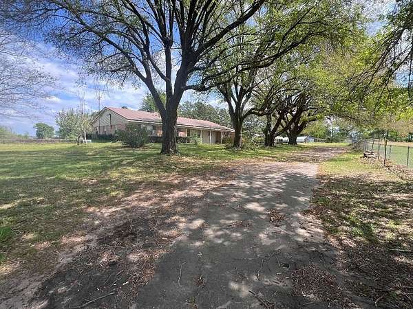 10 Acres of Land with Home for Sale in Carthage, Texas