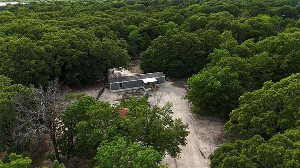 2.62 Acres of Land with Home for Sale in Quinlan, Texas