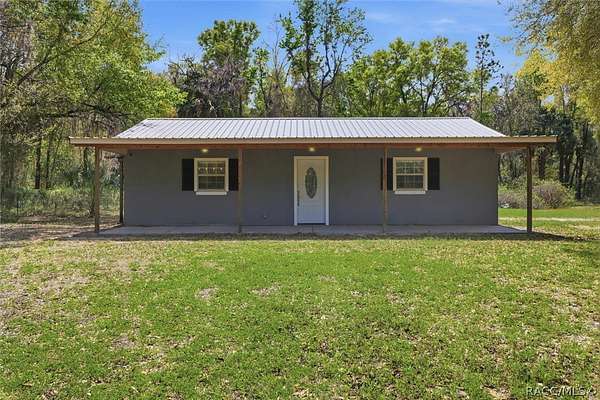 2.36 Acres of Land with Home for Sale in Inglis, Florida