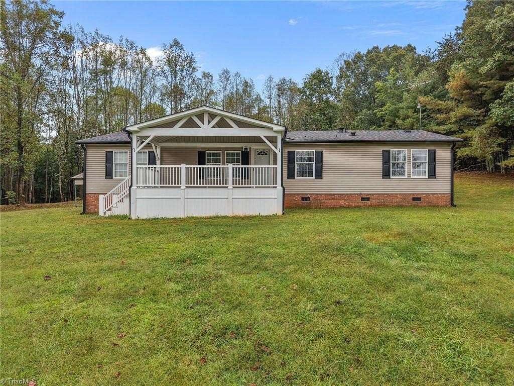 6.86 Acres of Land with Home for Sale in Lawsonville, North Carolina