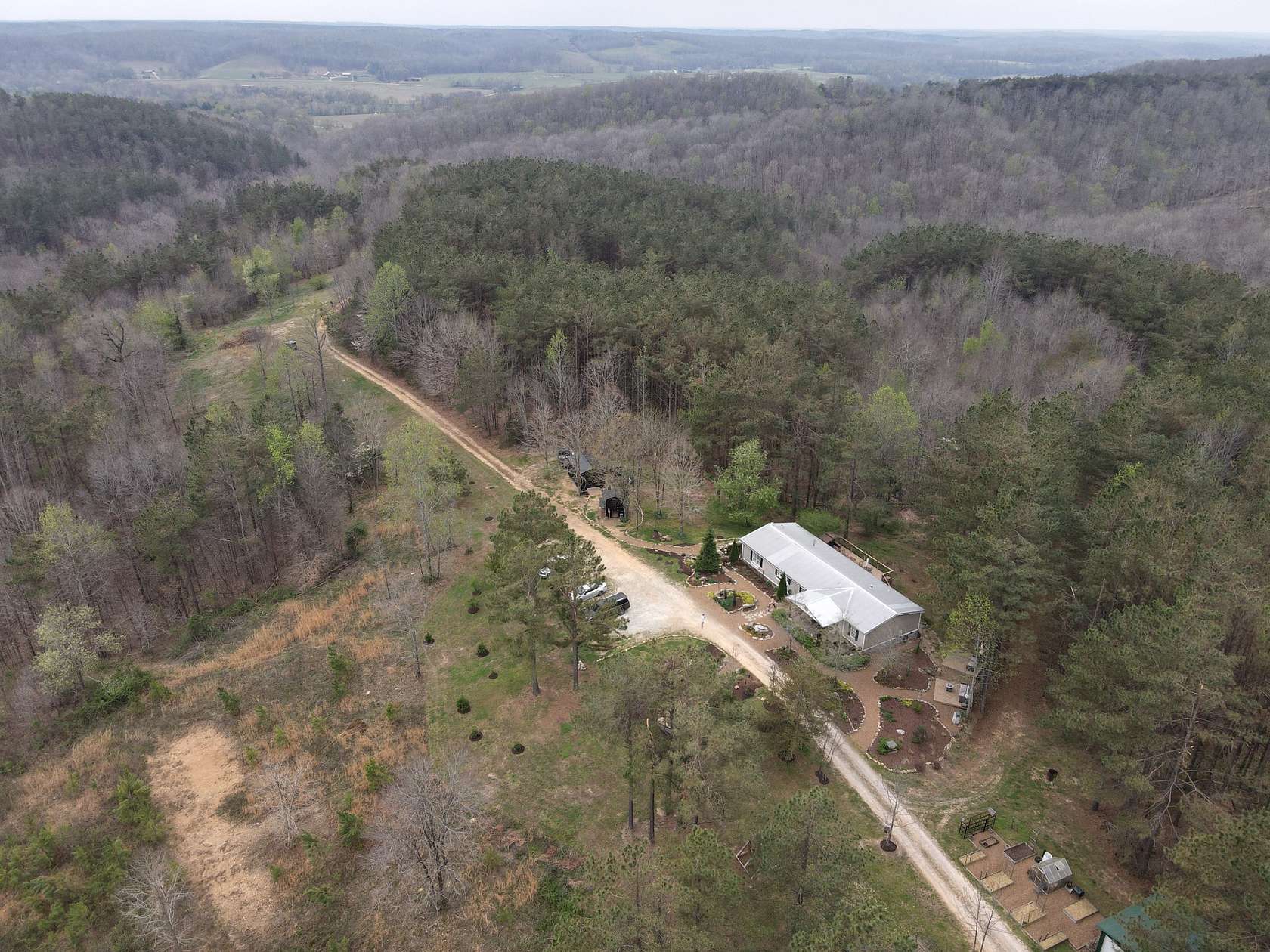 106 Acres of Recreational Land with Home for Sale in Hohenwald, Tennessee