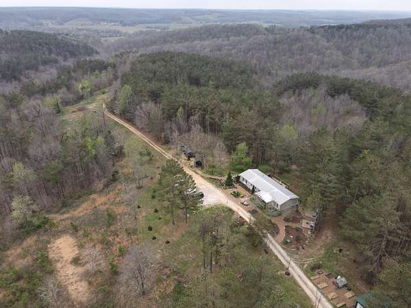 106 Acres of Recreational Land with Home for Sale in Hohenwald, Tennessee