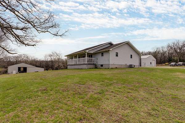 58 Acres of Land with Home for Sale in Fair Play, Missouri