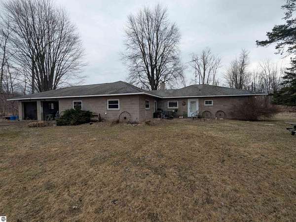 40 Acres of Recreational Land with Home for Sale in Turner, Michigan