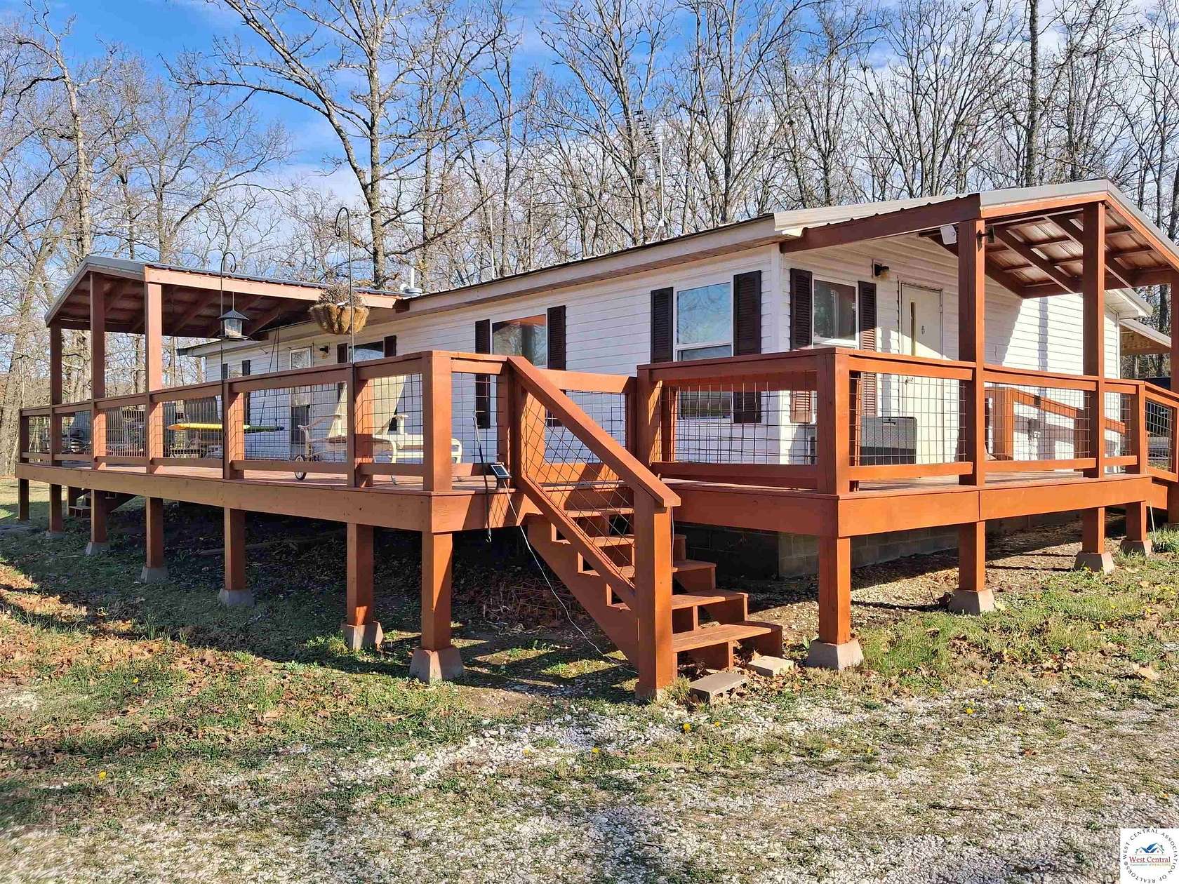 10 Acres of Land with Home for Sale in Humansville, Missouri