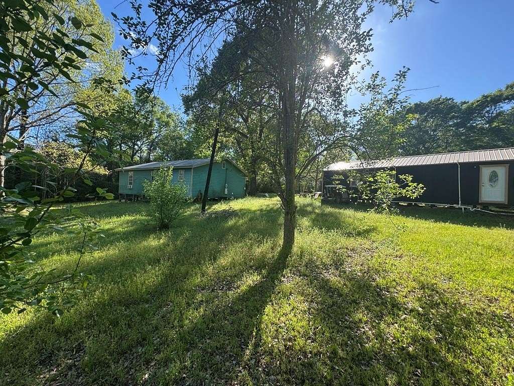 3.23 Acres of Land with Home for Sale in Colmesneil, Texas