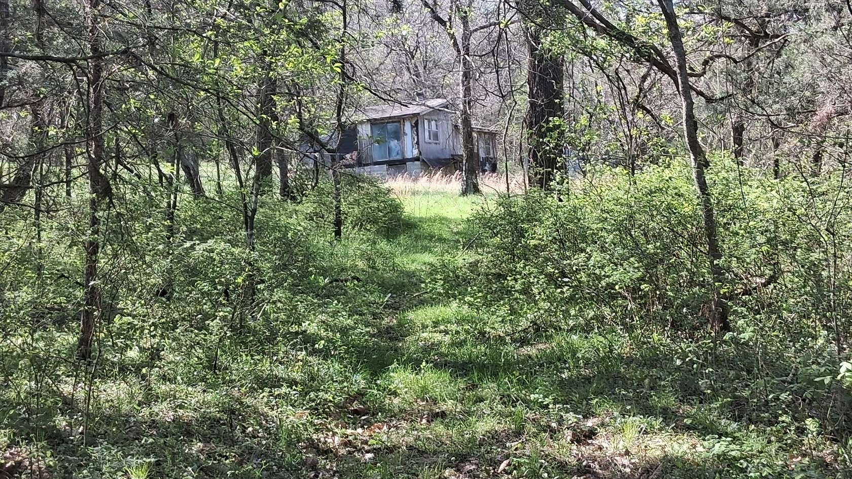 12.1 Acres of Land with Home for Sale in Cornersville, Tennessee