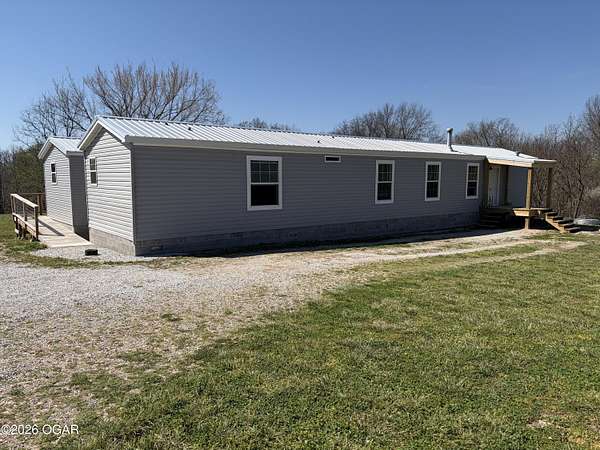 5 Acres of Land with Home for Sale in Rocky Comfort, Missouri