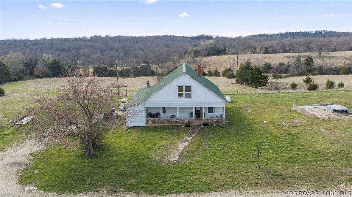 60 Acres of Agricultural Land with Home for Sale in Brumley, Missouri