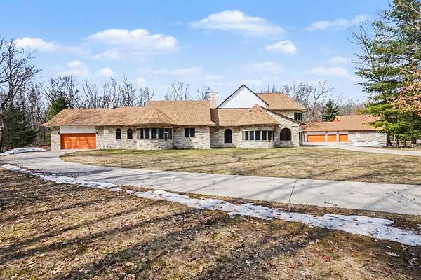 10 Acres of Recreational Land with Home for Sale in Irons, Michigan