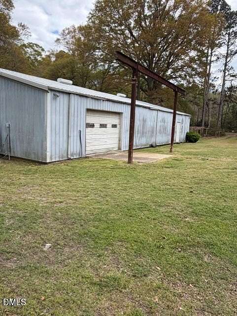 4.25 Acres of Land with Home for Auction in Angier, North Carolina