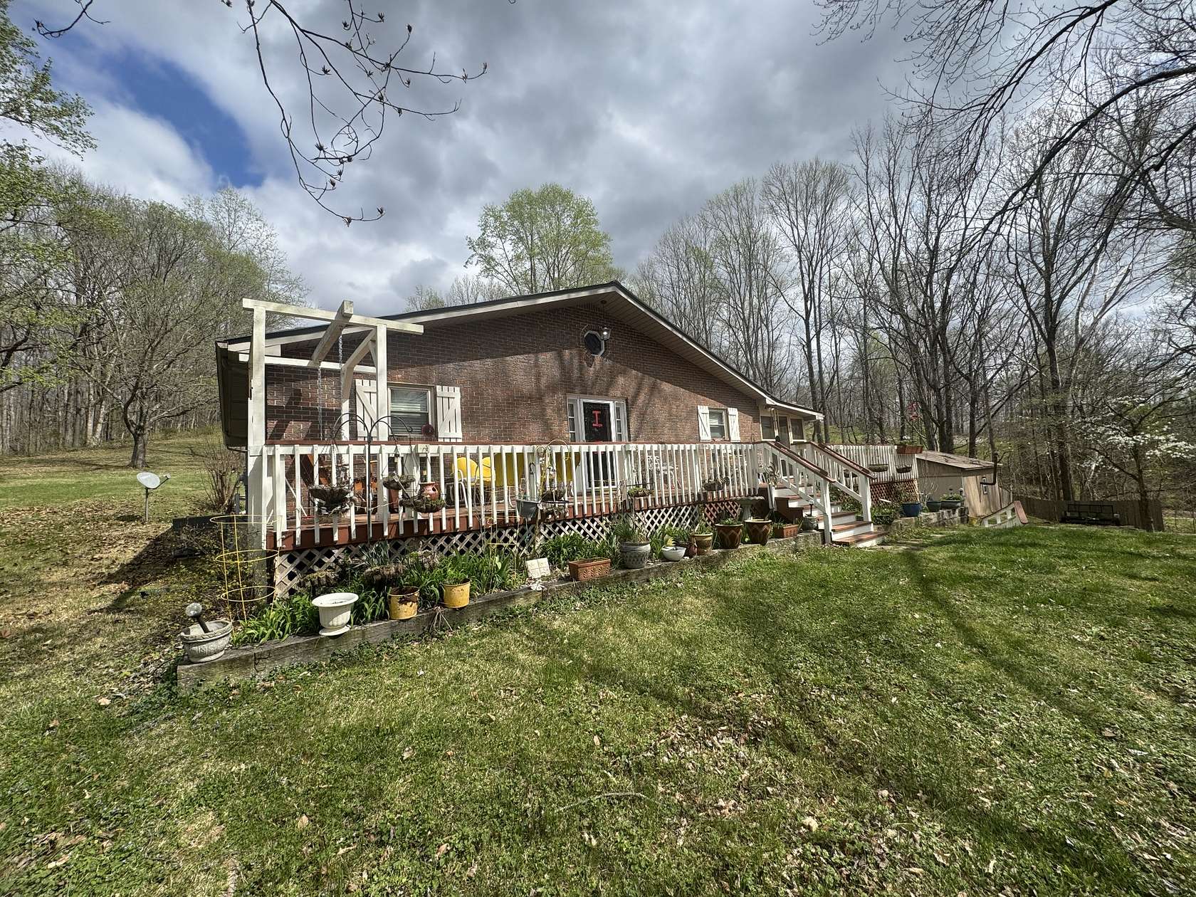 7.8 Acres of Land with Home for Sale in Lobelville, Tennessee