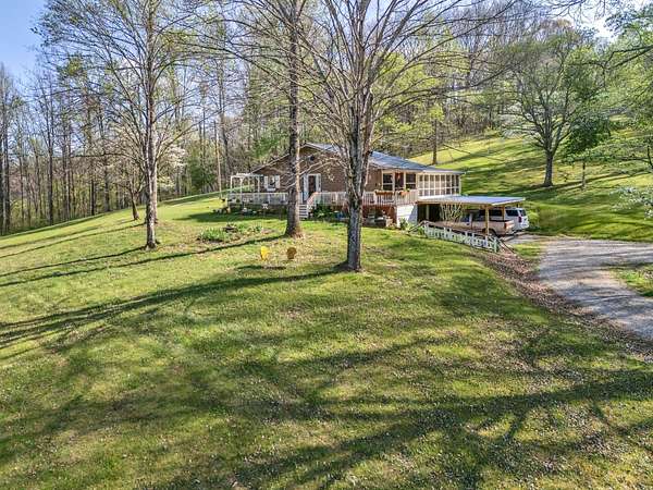 7.8 Acres of Land with Home for Sale in Lobelville, Tennessee