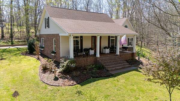 1.83 Acres of Land with Home for Sale in Burns, Tennessee