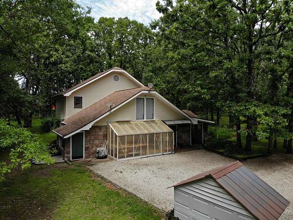 7.6 Acres of Land with Home for Sale in Wheatland, Missouri