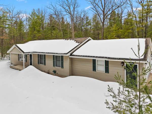 2.58 Acres of Land with Home for Sale in Rapid City, Michigan