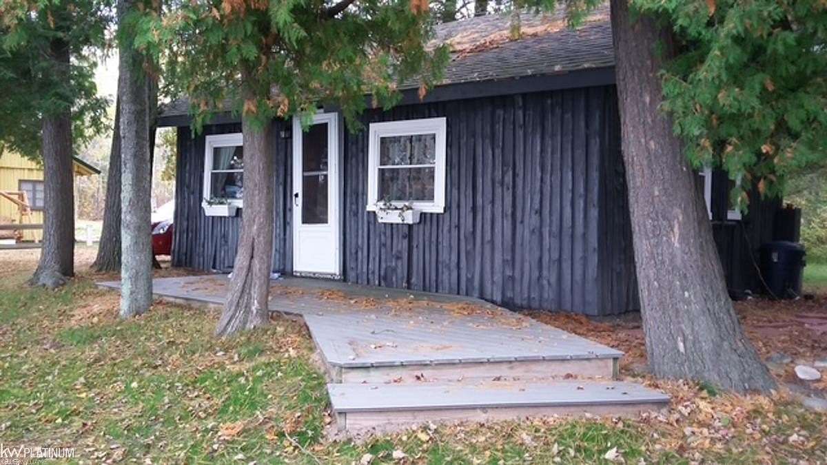 3.49 Acres of Land with Home for Sale in Kewadin, Michigan