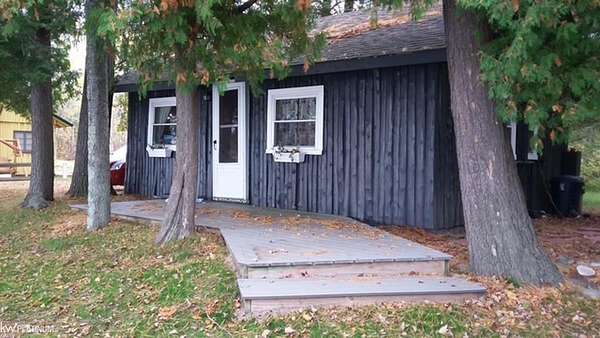 3.49 Acres of Land with Home for Sale in Kewadin, Michigan