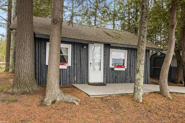 3.49 Acres of Land with Home for Sale in Kewadin, Michigan