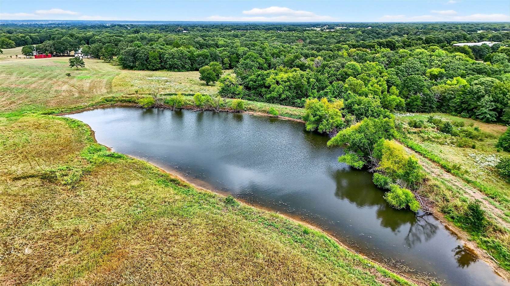 66 Acres of Land with Home for Sale in Savoy, Texas