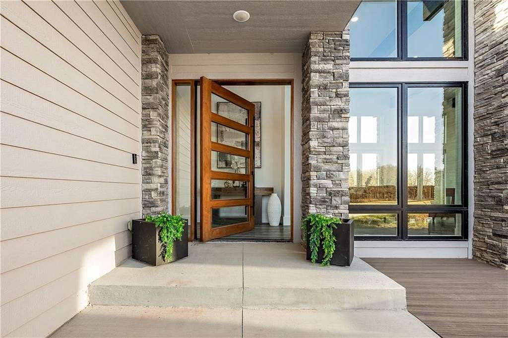 7.8 Acres of Land with Home for Sale in Gravette, Arkansas