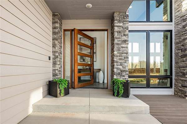 9.79 Acres of Land with Home for Sale in Gravette, Arkansas