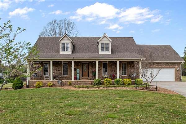 9.4 Acres of Land with Home for Sale in New Johnsonville, Tennessee