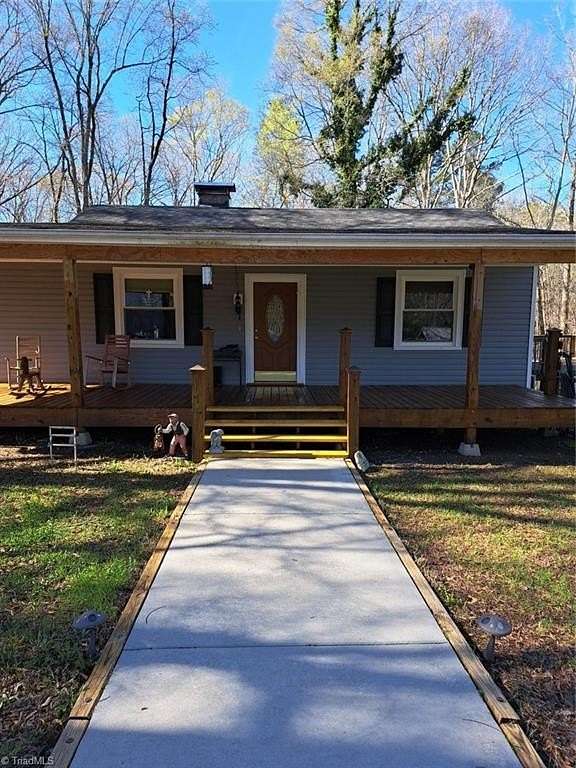 7.5 Acres of Land with Home for Sale in Gibsonville, North Carolina