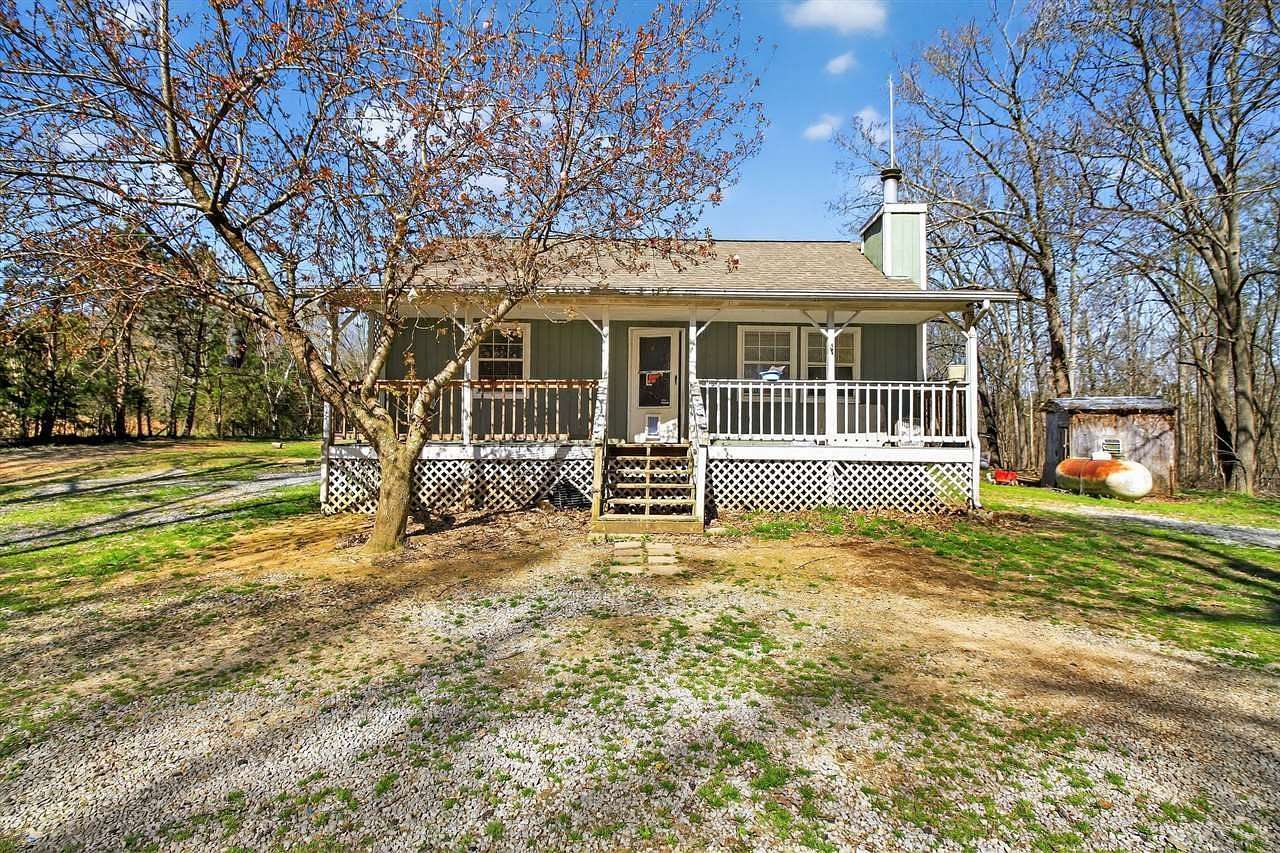 10.7 Acres of Land with Home for Sale in Scottsville, Kentucky