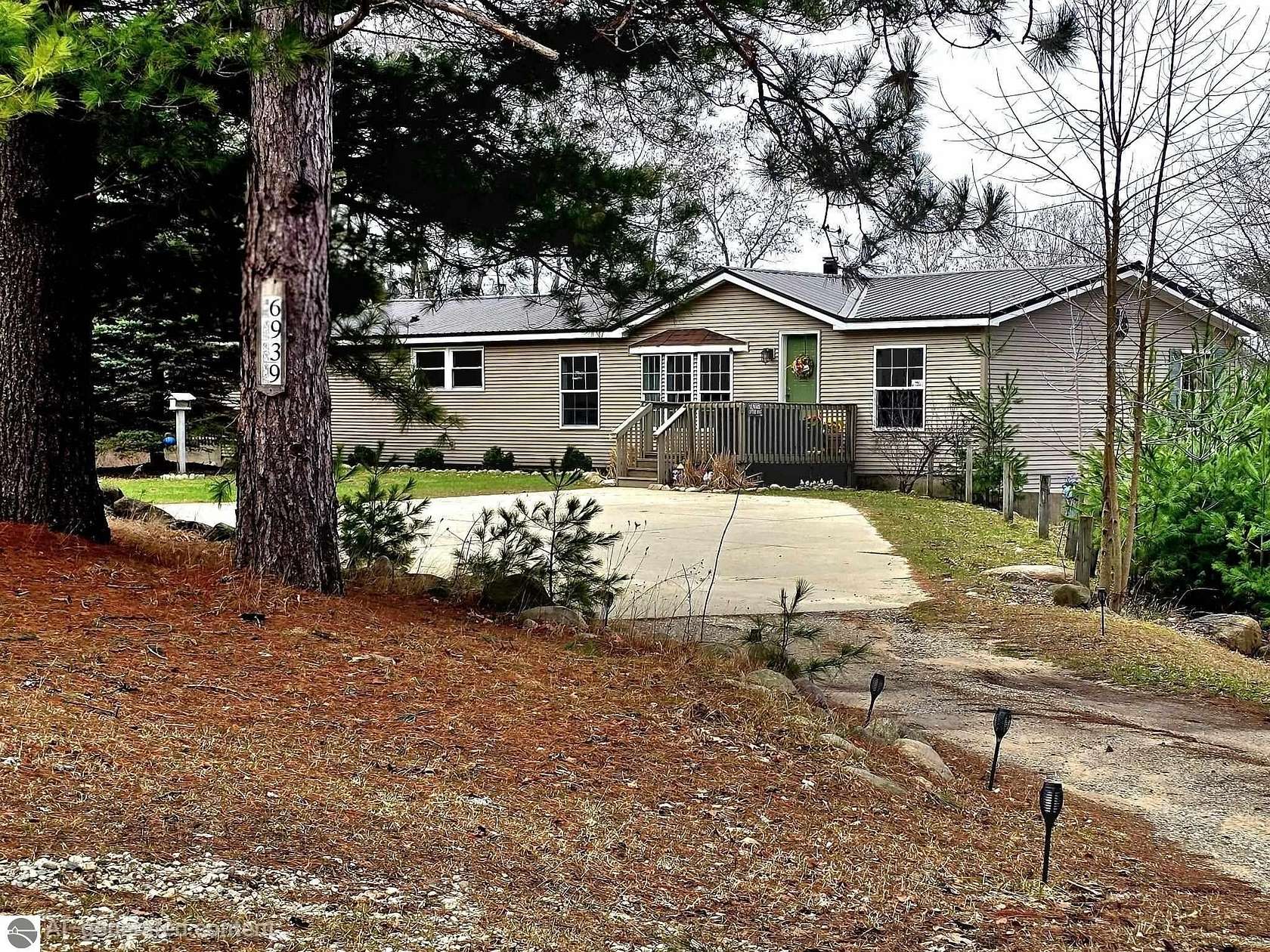 5 Acres of Land with Home for Sale in Stanwood, Michigan