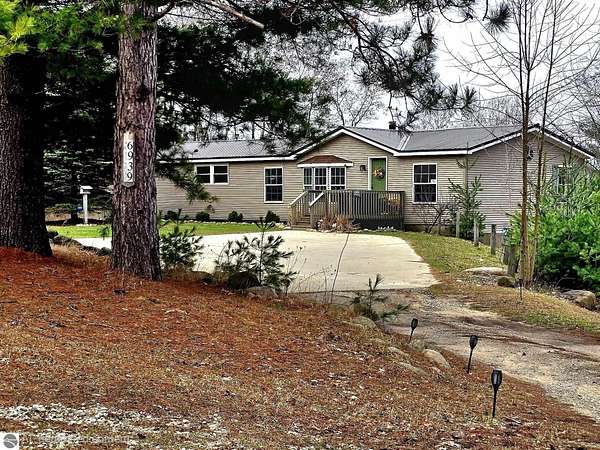 5 Acres of Land with Home for Sale in Stanwood, Michigan