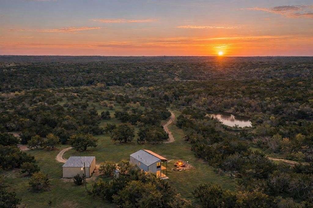 54 Acres of Agricultural Land with Home for Sale in Blanco, Texas