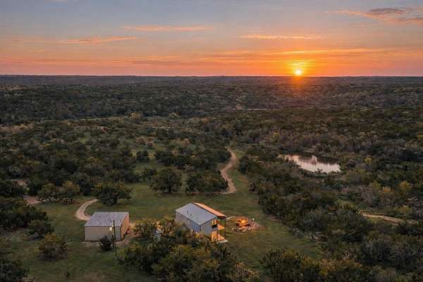 54 Acres of Agricultural Land with Home for Sale in Blanco, Texas