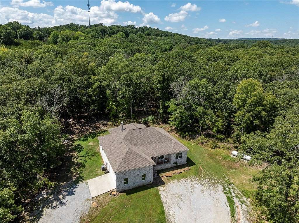 6.85 Acres of Land with Home for Sale in Elkins, Arkansas